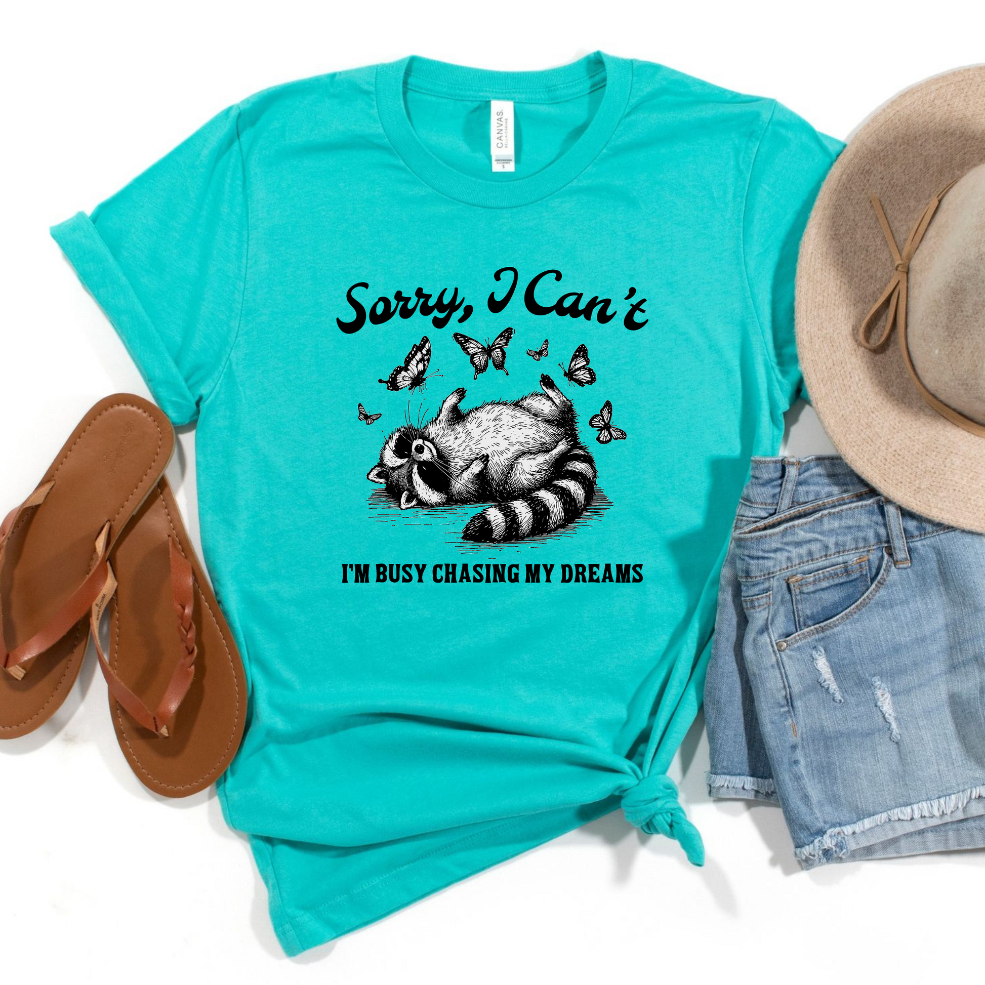 Wholesale Raccoon Busy Chasing Dreams Graphic Tee - Teal Tee